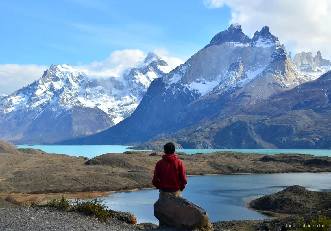 Horseback rider crossing open steppe on the Laguna Azul ride in Torres del Paine
